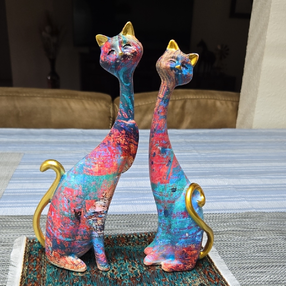 Artistic Resin Cat Sculptures with Gold Accents.